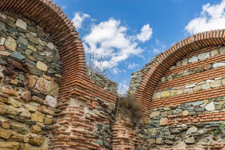 remains of stone walls with arches of ancient castle Histria, Romaniaの写真素材