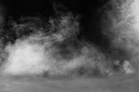 spectacular abstract white smoke isolated black backgroundの写真素材