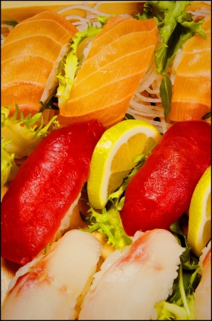 7 sushi 3 salmon 2 tuna 2 dorado in a boat の写真素材