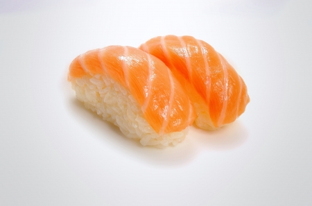 A pair of salmon sushi on a white background の写真素材