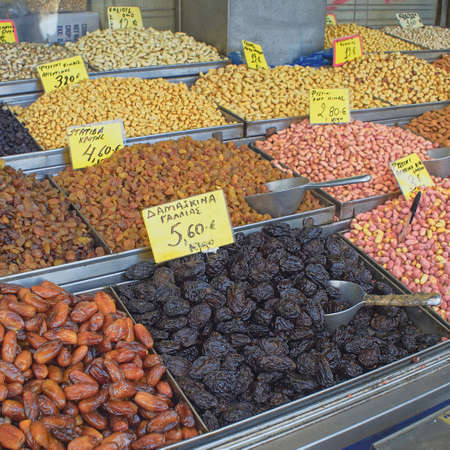 variety of dried food closeup, peanuts, raisins, plumsの写真素材