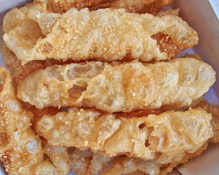 Diples, traditional Greek sweet fries with honey syrup and nuts