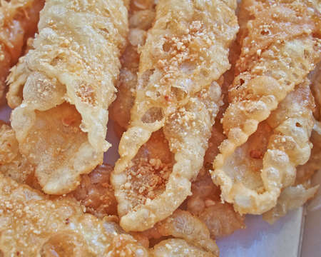 Diples, traditional Greek sweet fries with honey syrup and nutsの写真素材