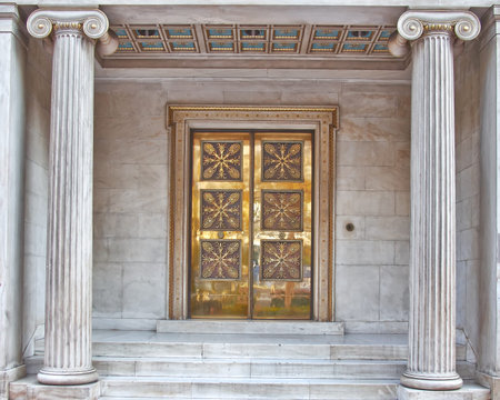 Vintage bronze door, Athens archeological society entrance, Greece