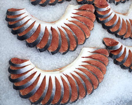 red salmon sliced at the central market, natural backgroundの写真素材