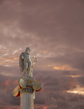 fiery cloudy sky over Apollo statue, the god of poetry and musicのeditorial素材