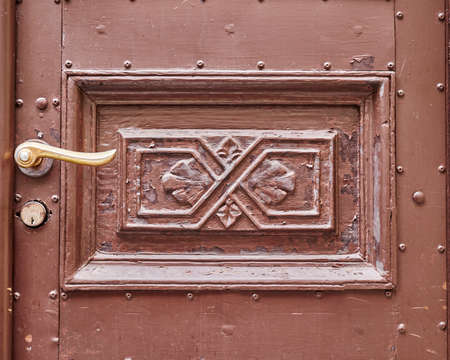 vintage door detail with bronze handleの写真素材