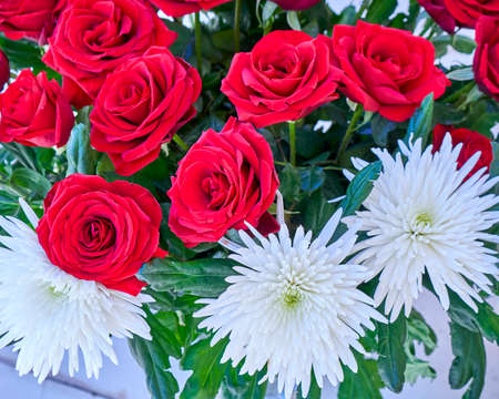 red roses and white chrysanthemums bouquet close upの写真素材