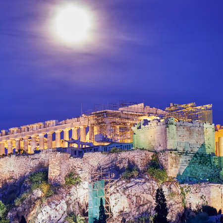 Athens Greece, acropolis illuminated under full moonの写真素材