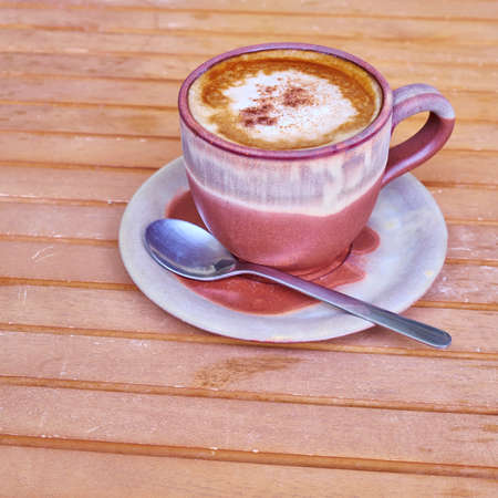 capuccino coffee in brown cup, cinnamon assortedの写真素材