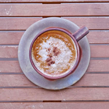 capuccino coffee in brown cup, cinnamon assortedの写真素材