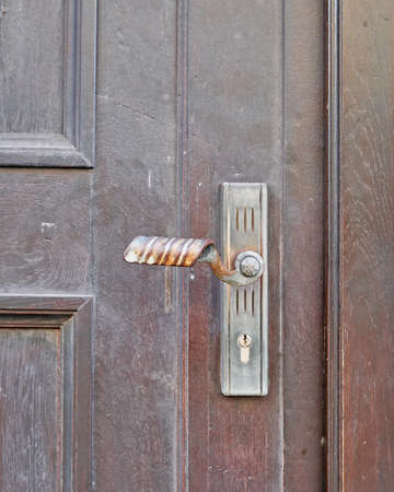 bronze handle of old wooden doorの写真素材