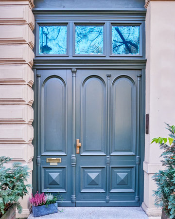 elegant dark blue green door and flowerpotの写真素材