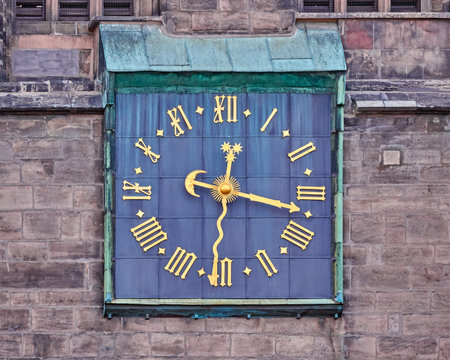 old clock with golden Roman numbersの写真素材