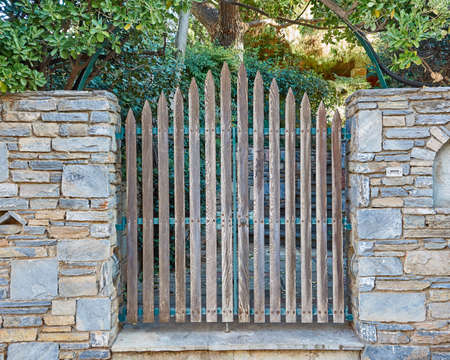traditional house entrance, wooden door and stone wallの写真素材