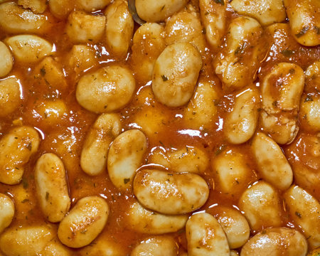 home made giant beans with tomato sauce closeup