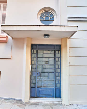 Athens Greece, vintage metallic entrance and "bull's eye" openingの写真素材