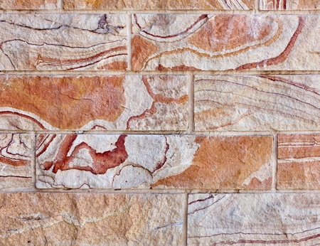 unusual curled pattern stone wall closeup