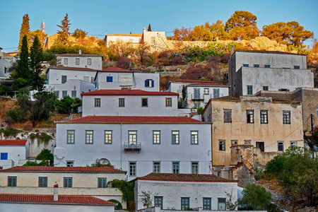 Greece, scenic view of sunlight over Hydra island town early in the morning