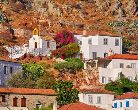 small church and white wall houses, Hydra island town, Greeceの写真素材