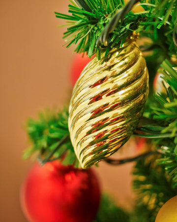 golden ball hanging on Christmas tree
