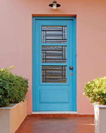 elegant house blue door on pink wall, Athens Greeceの写真素材