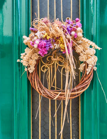 first of May wreath on vintage green doorの写真素材