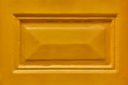 yellow painted wooden framed surface backgroundの写真素材