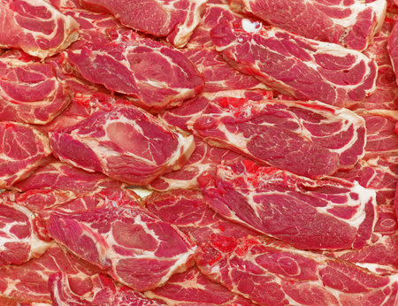 fresh raw meat steaks at the market