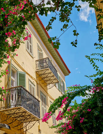 Greece, vintage house and flowers under blue skyの写真素材