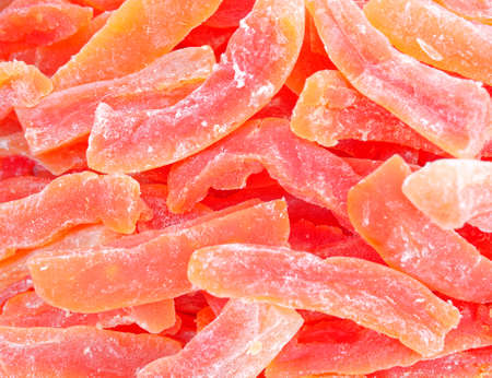 dried papaya closeup, natural red backgroundの写真素材