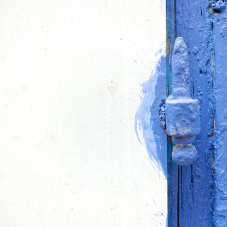 white board and blue painted old hinge