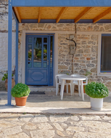 Greek island house entrance with blue doorの写真素材