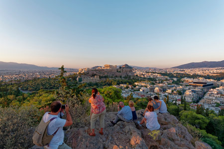 Tourists shooting acropolis and Athens cityscapeのeditorial素材
