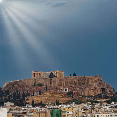 Athens Greece, Acropolis and sun rays on a rainy dayの写真素材
