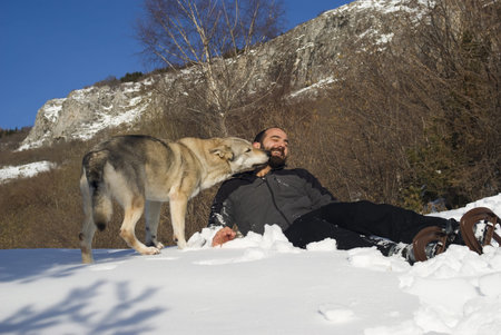 Man playing with dog
