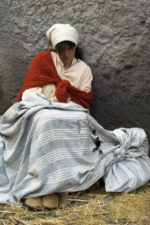 Taggia, Italy  February 27, 2011: Historical reenactment participant. This image: Sad poor woman のeditorial素材