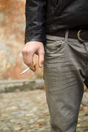 Teenage boy smokingの写真素材