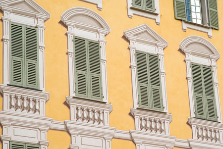 Colorful house wall with windows in Mediterranean style