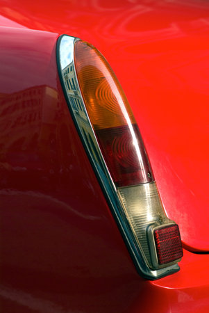Imperia, Italy – October 19, 2013  Close up detail of a Ferrari 330 GT cruising on the road in...