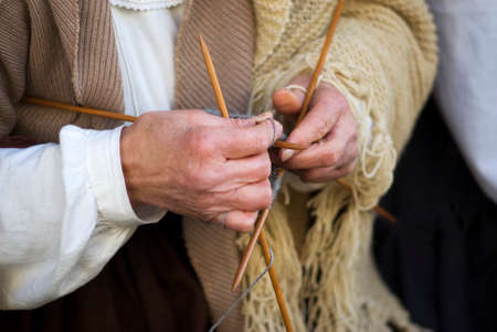 Mature woman knitting woolの写真素材