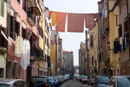 Italy, Veneto. Typical street in old town of Chioggiaの写真素材