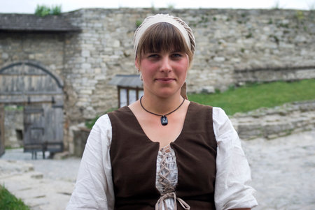 Kamyanets-Podilsky, Ukraine "May 15, 2016: Woman posing in traditional costume inside the medieval fortress of Kamyanets-Podilsky, located in the Western Ukraineのeditorial素材