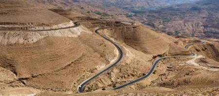 View of a winding road through the Wadi al Hasa, South Jordanの写真素材