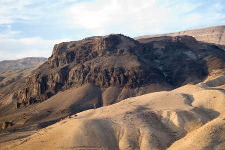 Volcanic plug rising through eroded sandstone near Wadi Hasa, Jordanの写真素材