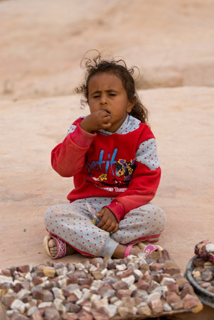 Petra, Jordan - October 26, 2016: Jordanian Bedouin girl sells souvenirs in Petraのeditorial素材