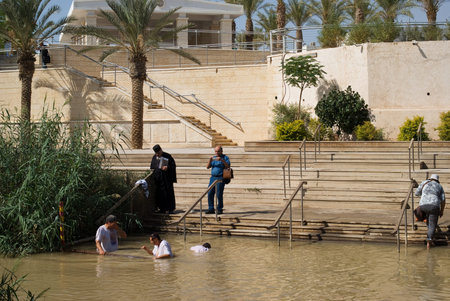Qasr el Yahud, Israel - October 29, 2016: Religious Christians Themselves plunged into the waters of the Jordan River baptismal site of Qasr el Yahud in Israel. The baptismal site on the banks of the Jordan River, is the site where according to Functionalのeditorial素材