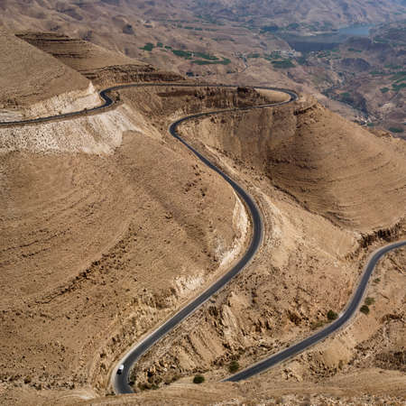 View of a winding road through the Wadi al Hasa, South Jordanの写真素材