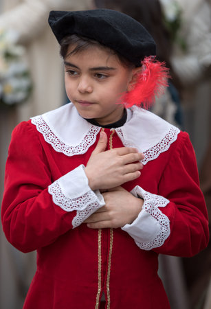 Taggia, Italy - February 26, 2017: Close-up of participant the medieval costume party in the historic city of Taggia in Liguria region of Italy. The actors acting out episodes of daily life in settings that evoke moments of life lived fully the seventeentのeditorial素材