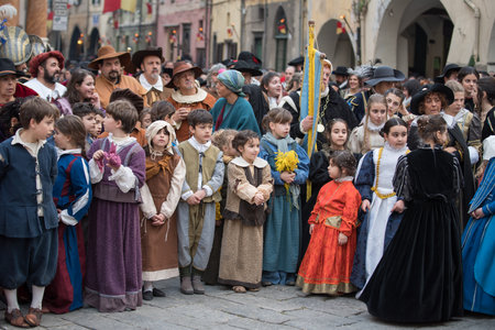 Taggia, Italy - February 26, 2017: Participants of medieval costume party in the historic city of Taggia in Liguria region of Italy. The actors acting out episodes of daily life in settings that evoke moments of life lived fully the seventeenth century. Tのeditorial素材